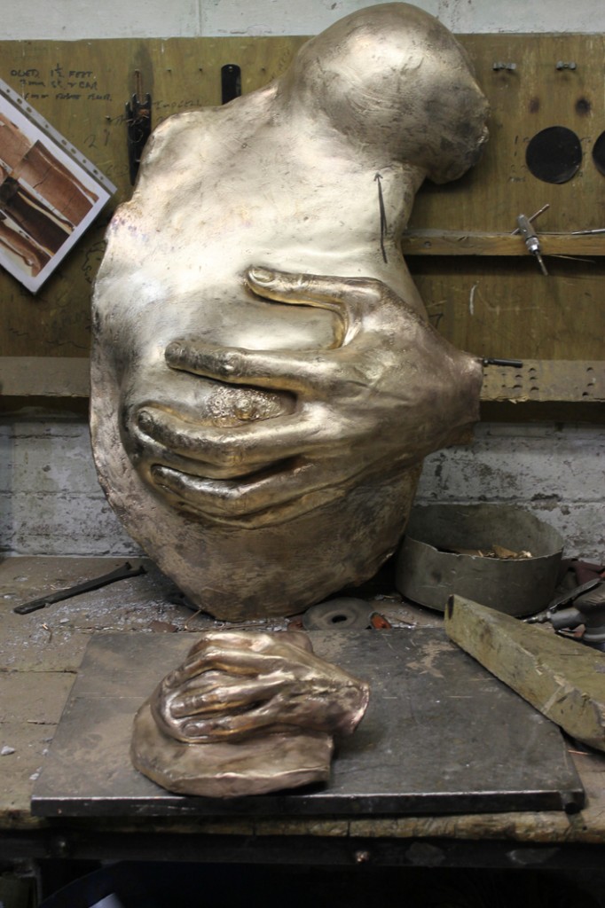 Raw bronze breasts in progress at foundry